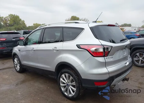 2017 Ford Escape Titanium z USA, uszkodzony, nr VIN 1FMCU0J90HUB80160